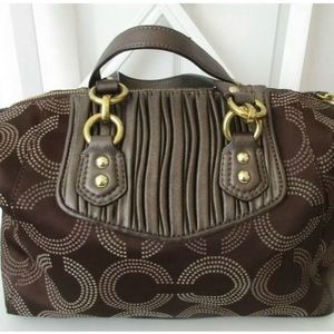 Coach rarely used. Brown with pink lining inside. Good Condition